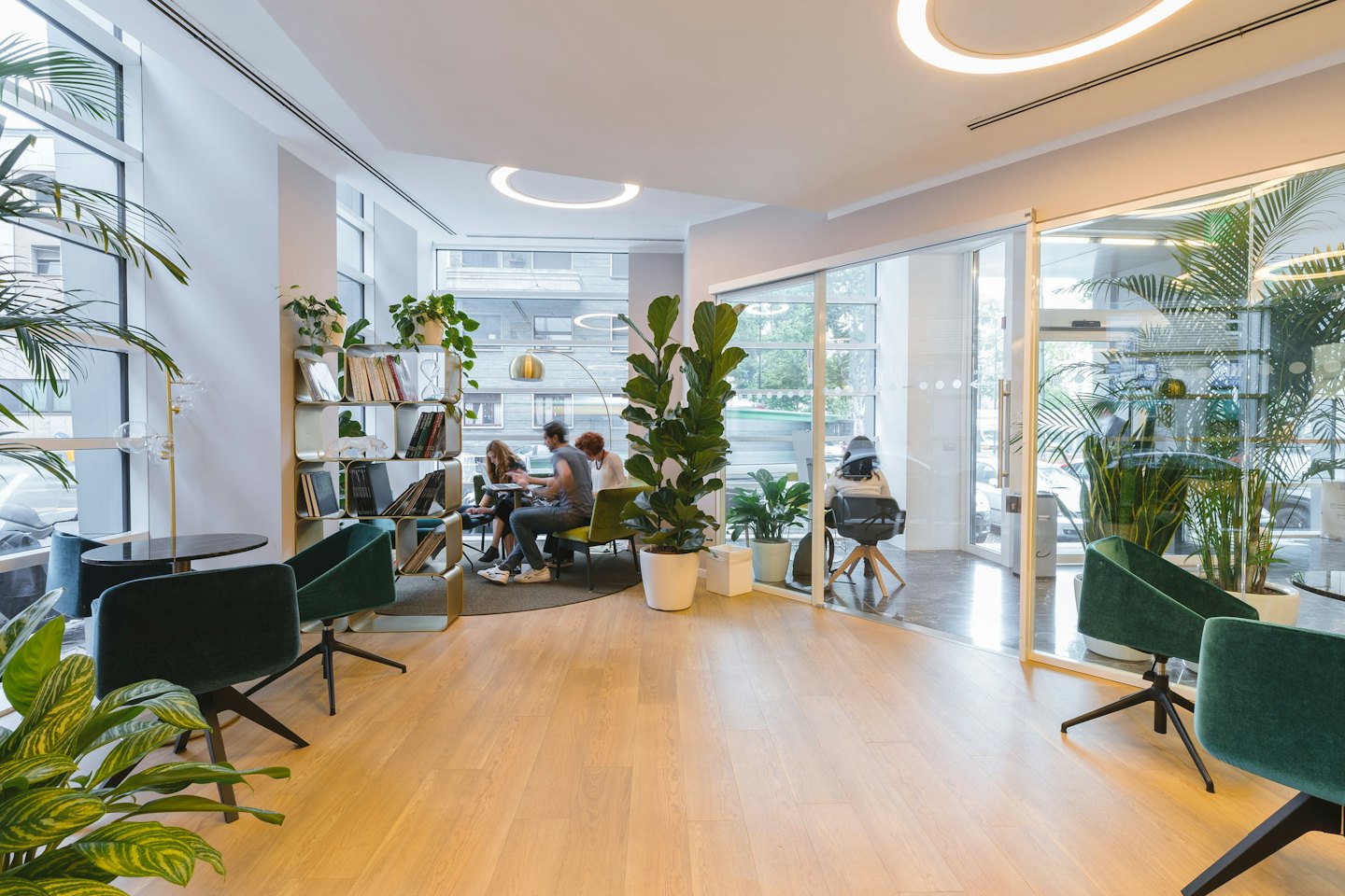 People collaborating and working individually in a modern co-working space.